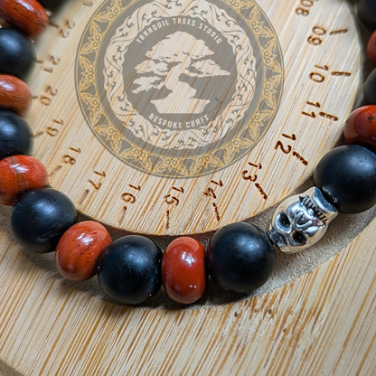 “Root fire” – Red Jasper, Frosted Black Onyx Bracelet with Skull Accent | Grounding Handmade Bracelet
